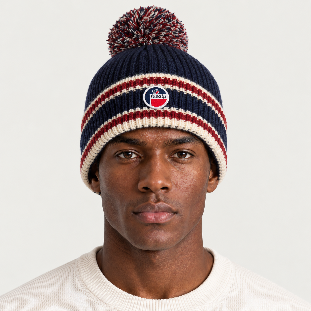 Fusalp unisex Pompon Beanie in Marin, view on male model.