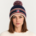 Fusalp unisex Pompon Beanie in Marin, front view on female model.