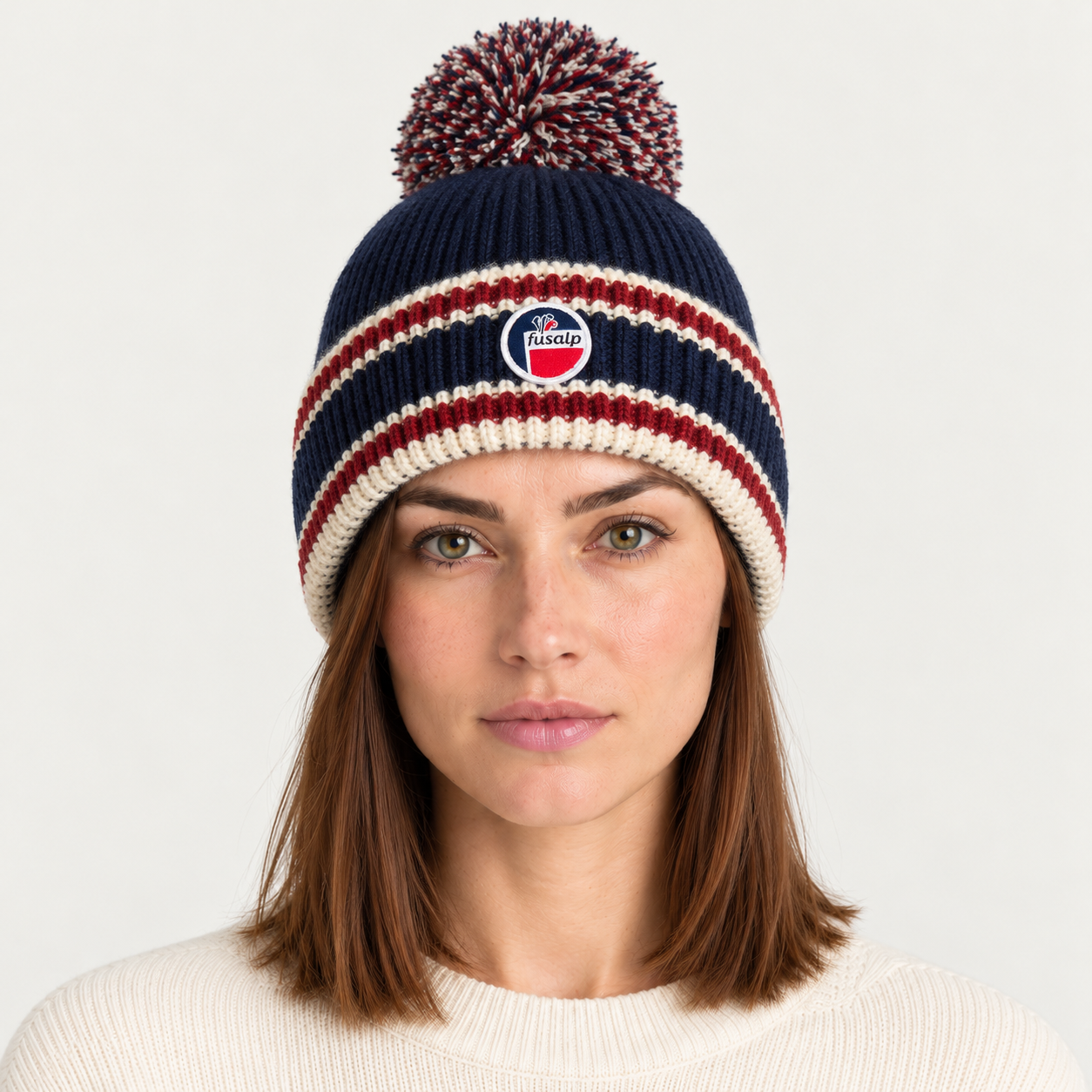 Fusalp unisex Pompon Beanie in Marin, view on female model.