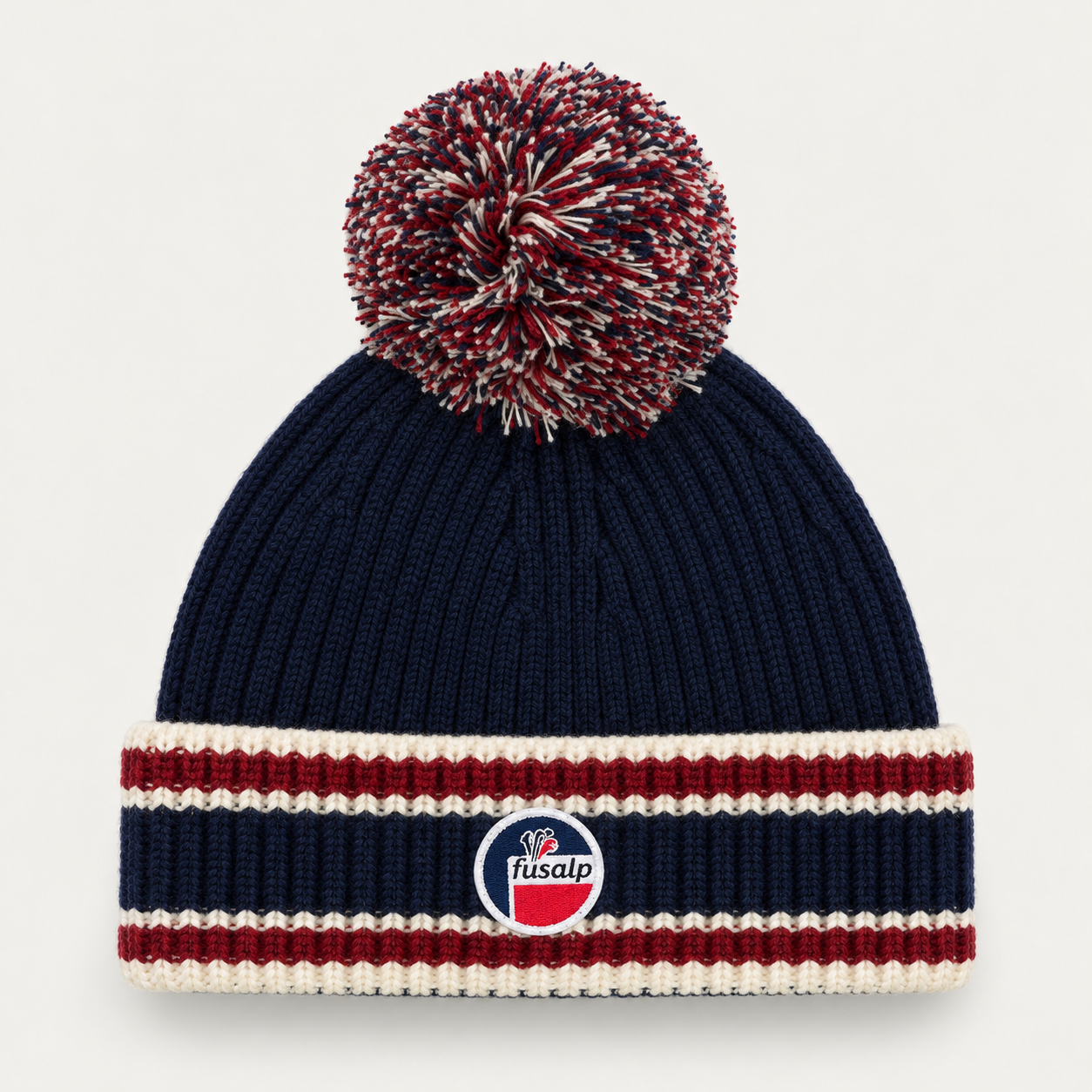 Fusalp unisex Pompon Beanie in Marin, product view showing knit texture and branding.