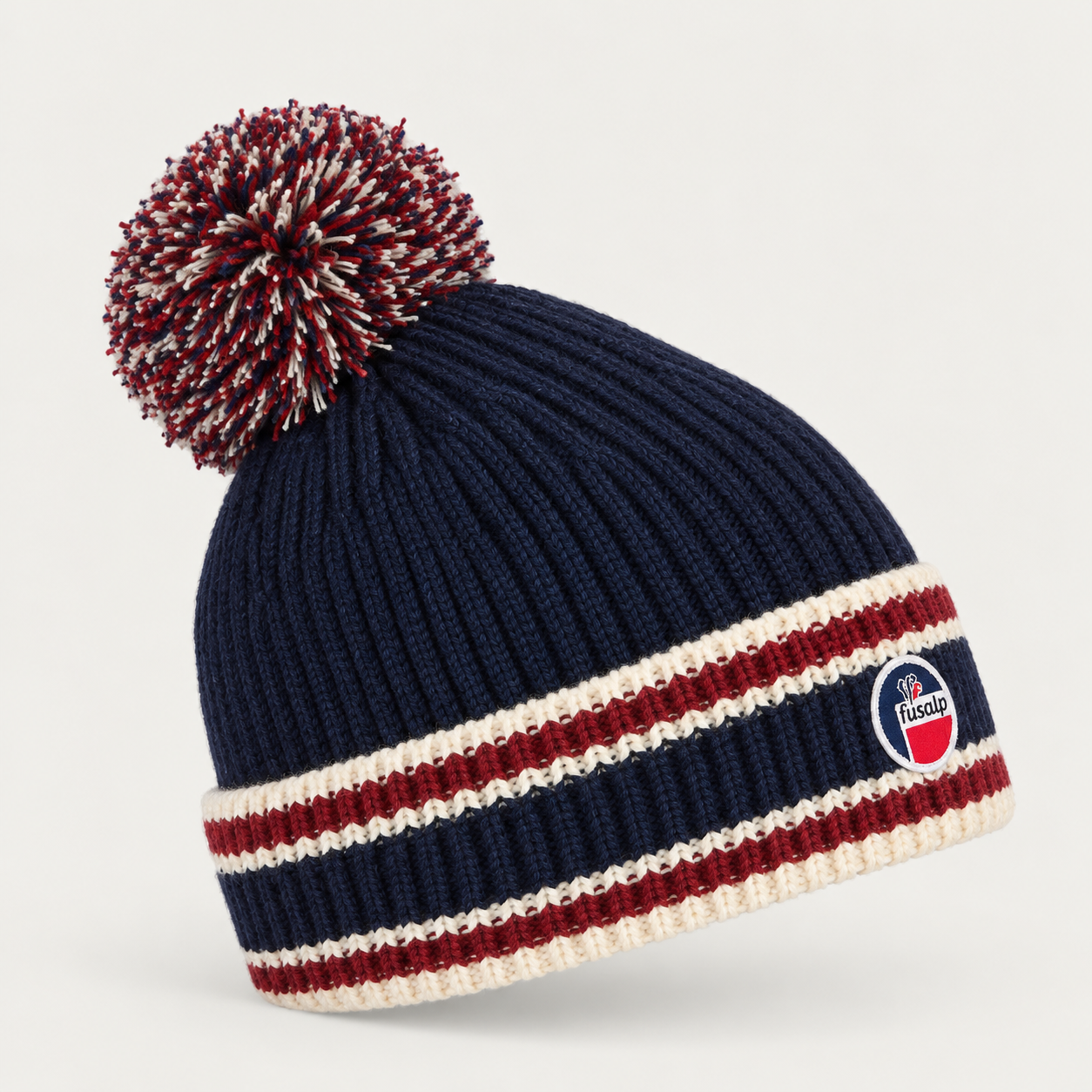 Fusalp unisex Pompon Beanie in Marin, side product view.