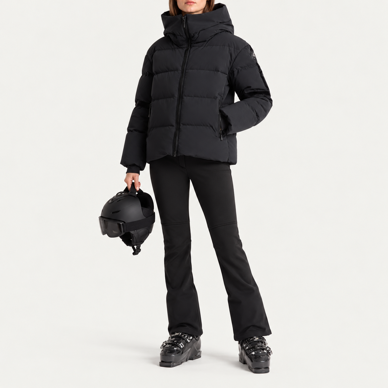 Fusalp women's Barsy II Ski Jacket in Black, full outfit on model holding a ski helmet.