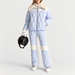 Fusalp women's Beqya Ski Jacket in Nuage, full outfit on model holding a ski helmet.