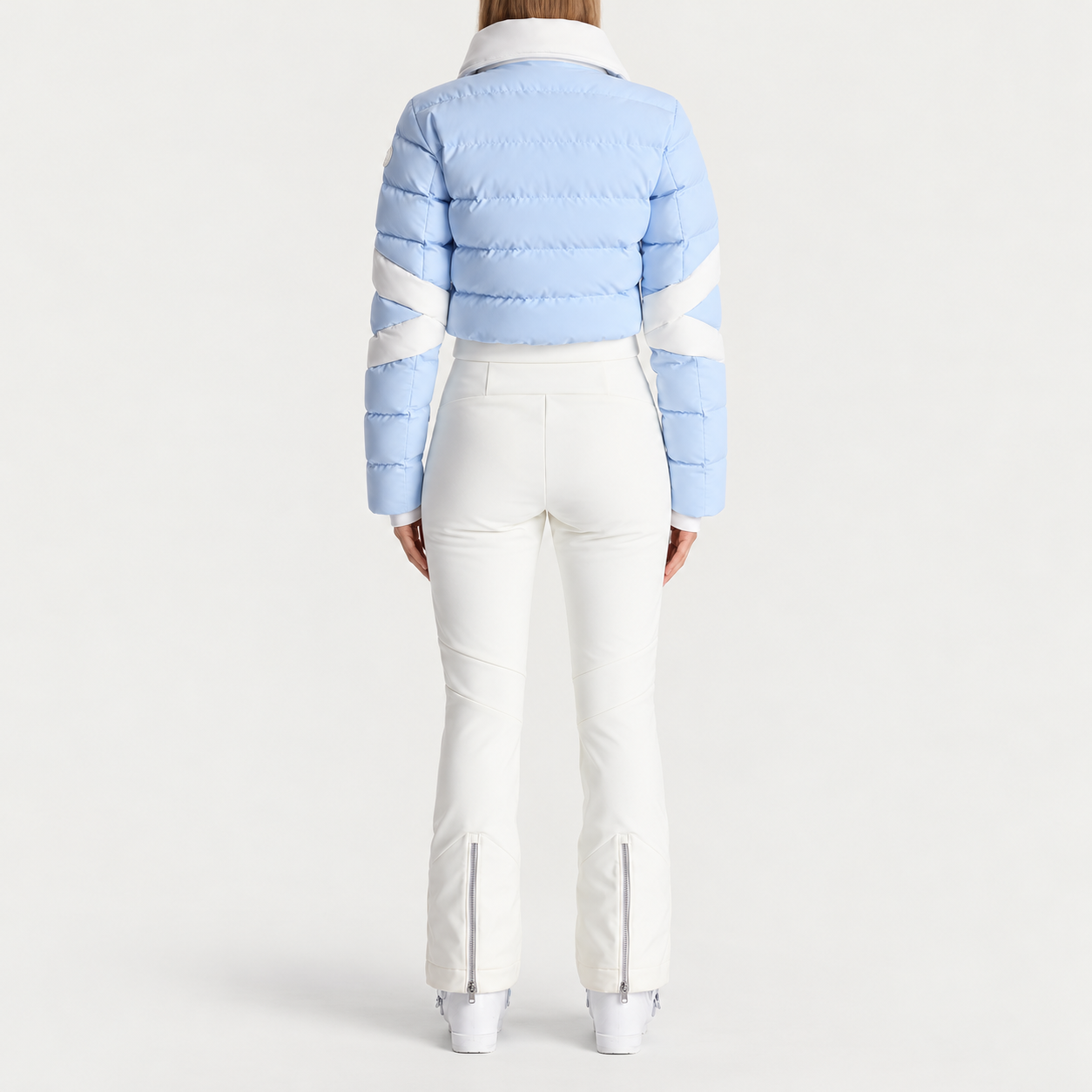 Fusalp women's Clarisse Ski Suit in Cloud Blue, back view on model.