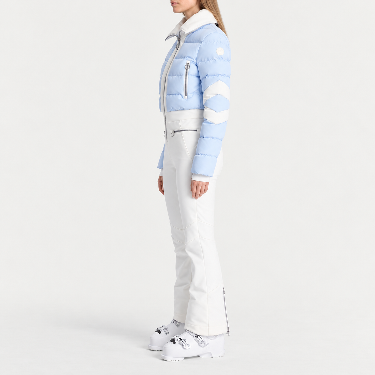 Fusalp women's Clarisse Ski Suit in Cloud Blue, side view on model.
