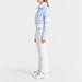 Fusalp women's Clarisse Ski Suit in Cloud Blue, side view on model.