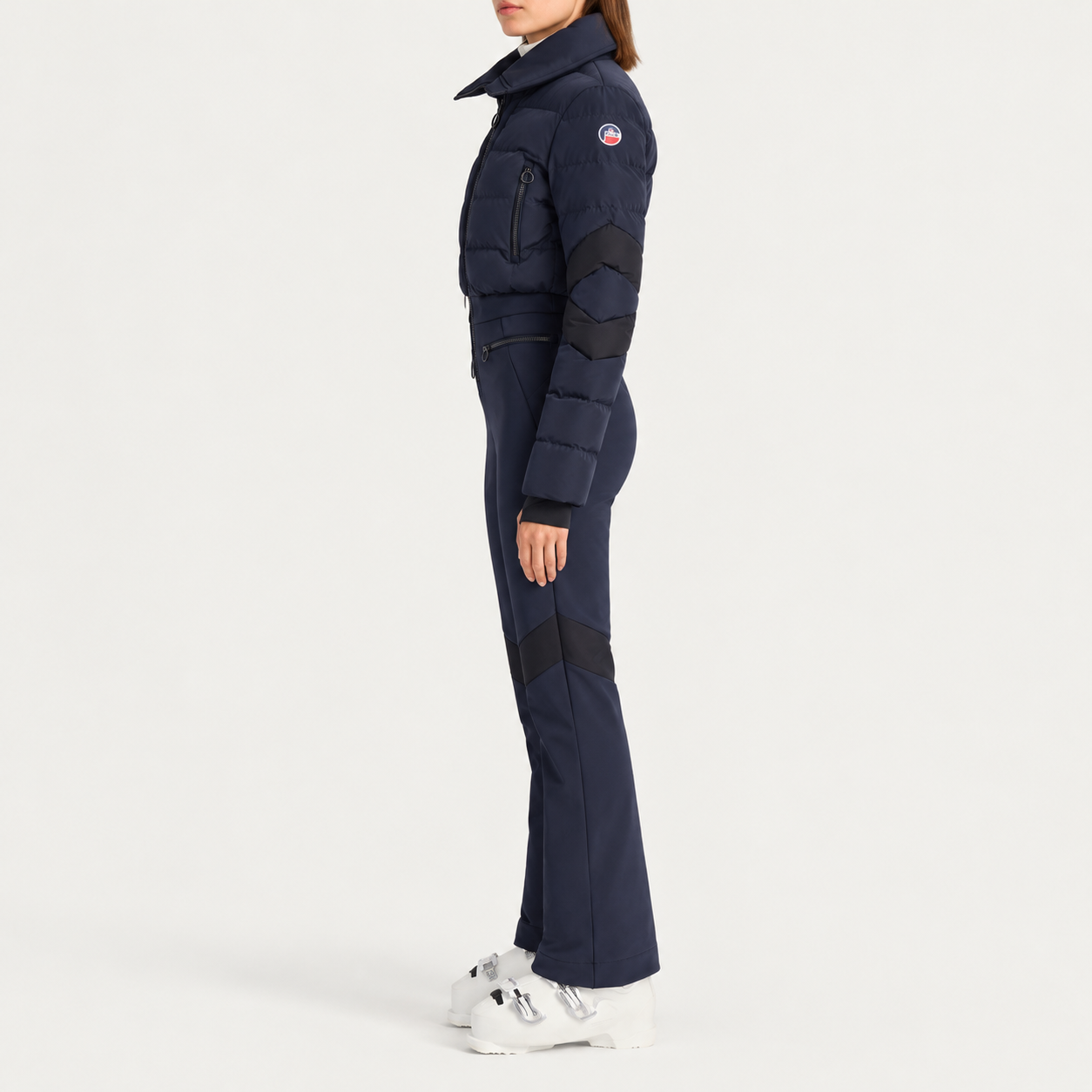 Fusalp women's Clarisse Ski Suit in Navy, side view on model.