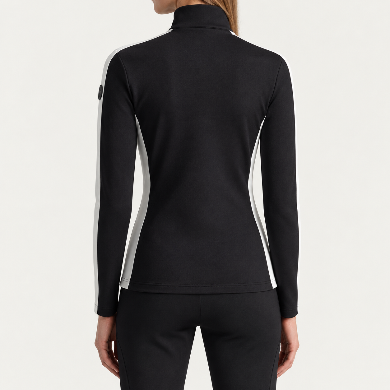 Fusalp women's Negam Midlayer in Black, back view on model.