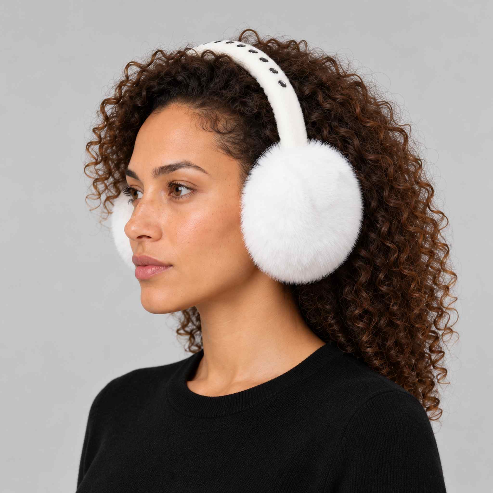 Goldbergh unisex Fluffy Earwarmers in White (Snow White) - womens side. AI-generated from manufacturer imagery.