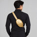 Goldbergh Hinata Bum Bag in Rich Gold - mens back. AI-generated from manufacturer imagery.