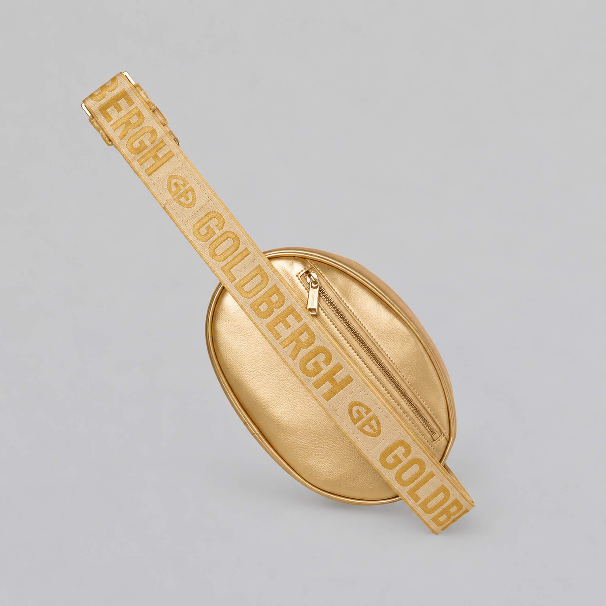 Goldbergh Hinata Bum Bag in Rich Gold - side. AI-generated from manufacturer imagery.