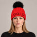Goldbergh Hodd Beanie in Flame Red in Flame — womens front. AI-generated from manufacturer reference photographs.
