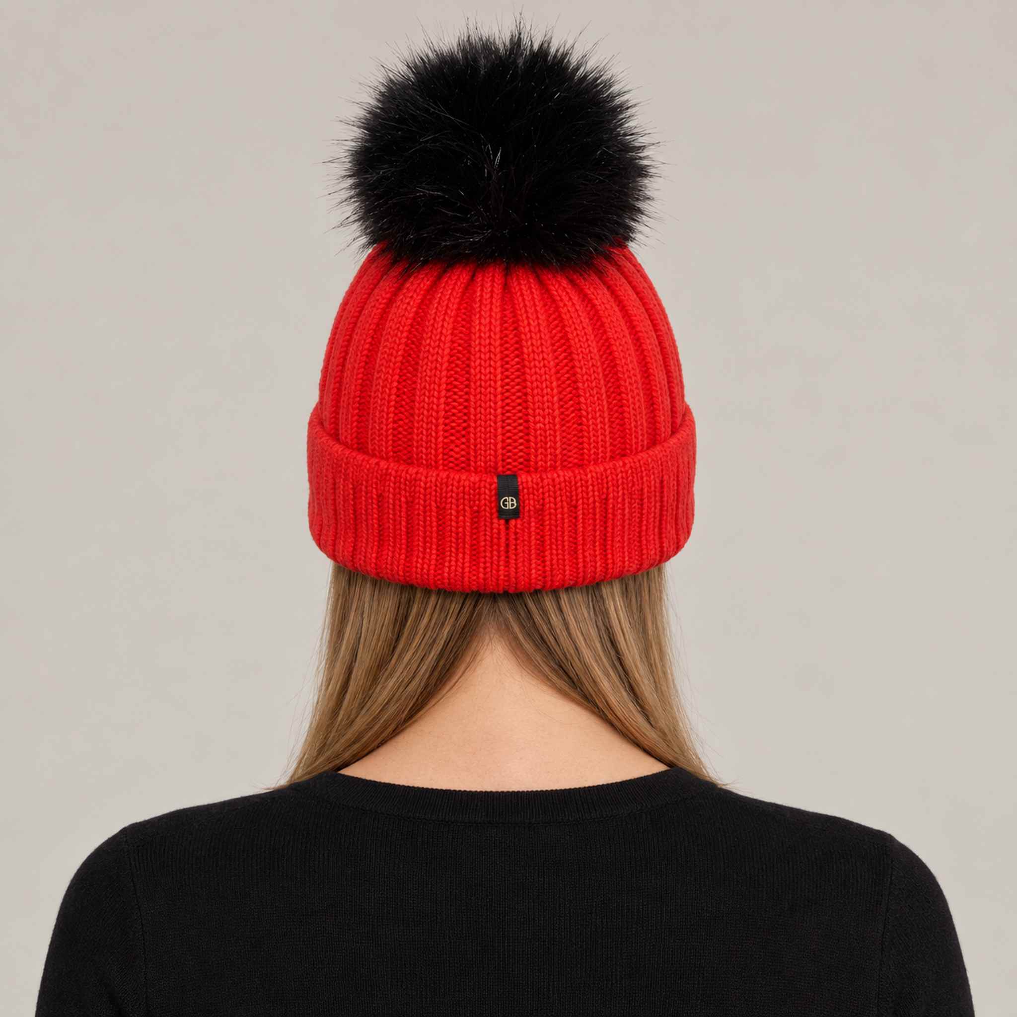 Goldbergh Hodd Beanie in Flame Red in Flame — womens back. AI-generated from manufacturer reference photographs.