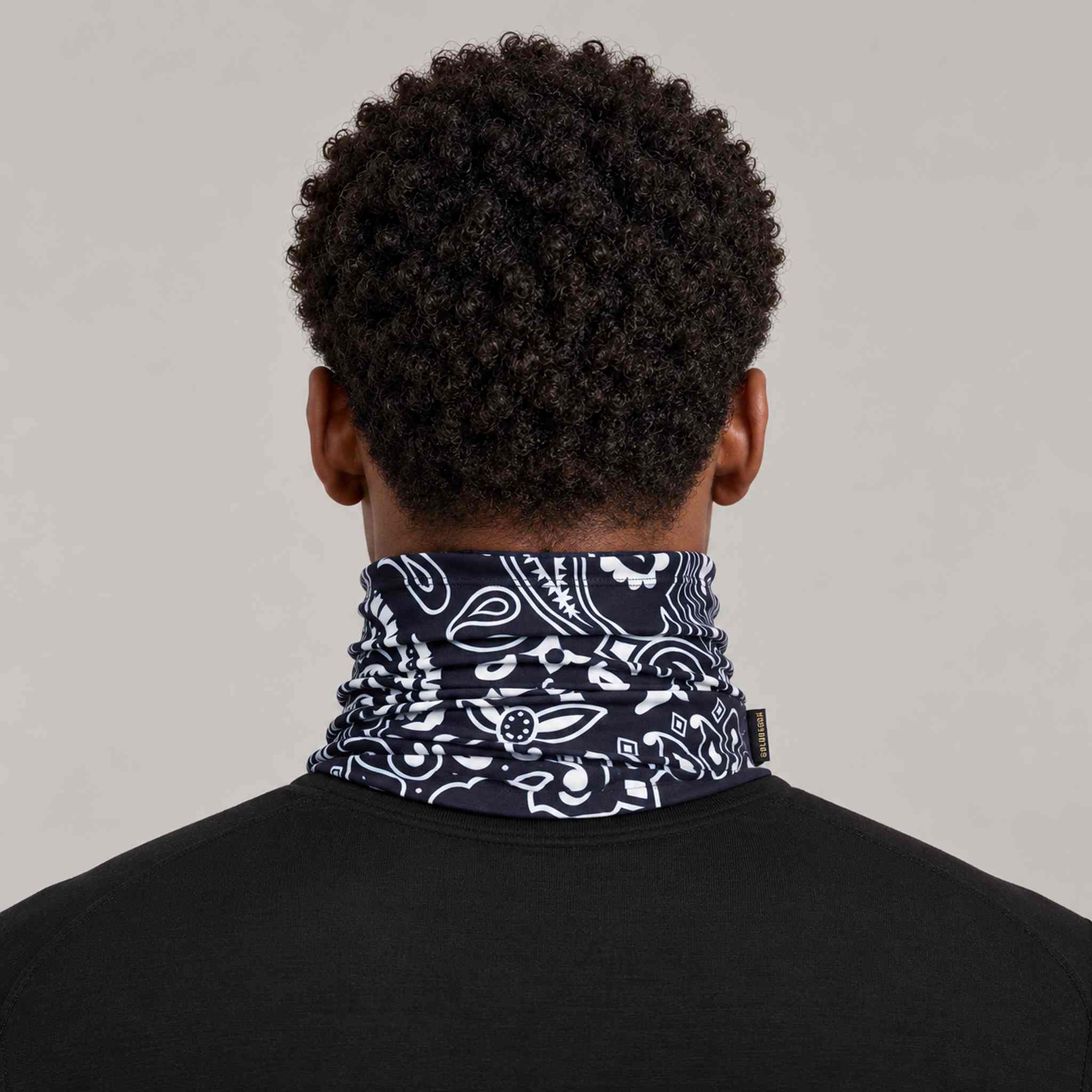 Goldbergh Kizuna Neck Gaiter in Bandana Paisley Blue in Bandana Paisley Blue — mens back. AI-generated from manufacturer reference photographs.
