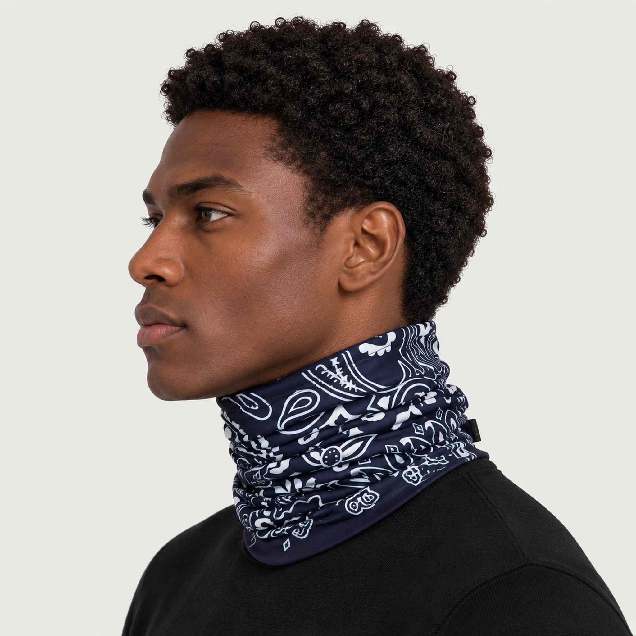 Goldbergh unisex Kizuna Neck Gaiter in Bandana Paisley Blue (Bandana Paisley Blue) - mens side. AI-generated from manufacturer imagery.