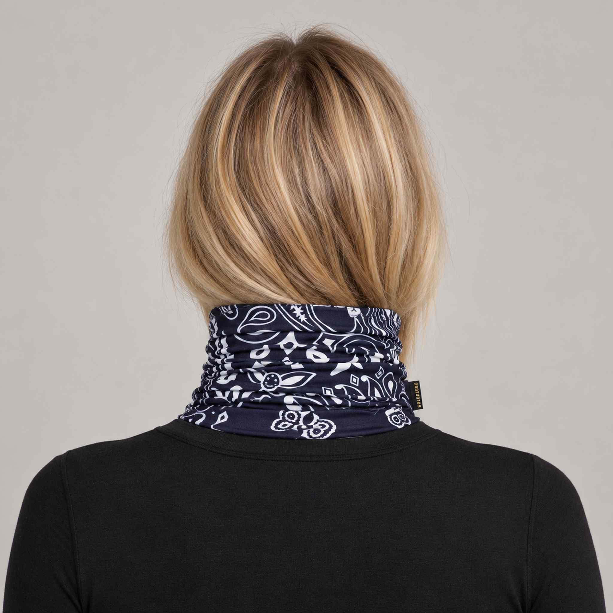 Goldbergh Kizuna Neck Gaiter in Bandana Paisley Blue in Bandana Paisley Blue — womens back. AI-generated from manufacturer reference photographs.