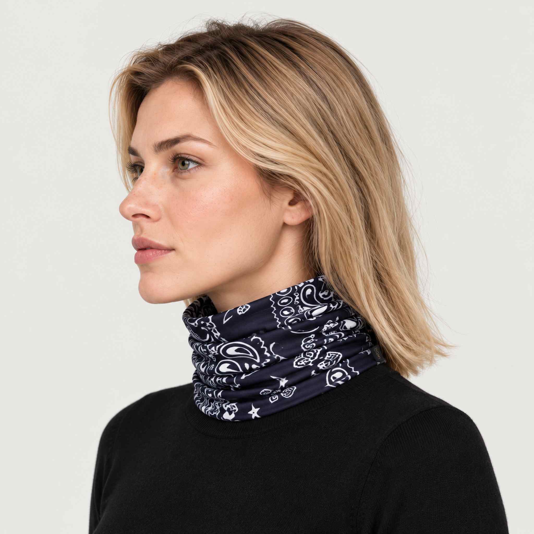 Goldbergh unisex Kizuna Neck Gaiter in Bandana Paisley Blue (Bandana Paisley Blue) - womens side. AI-generated from manufacturer imagery.