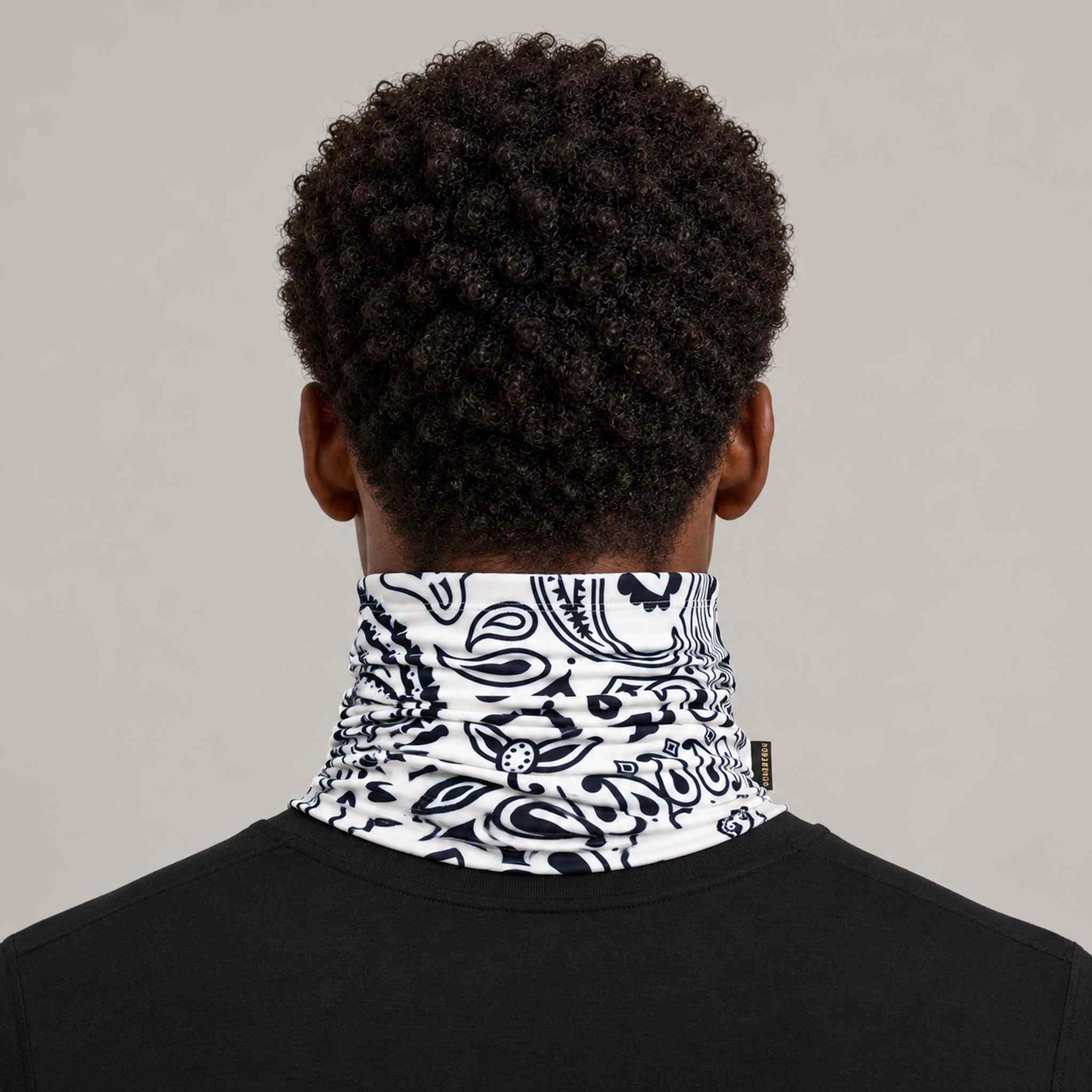 Goldbergh Kizuna Neck Gaiter in Paisley White in Paisley White — mens back. AI-generated from manufacturer reference photographs.