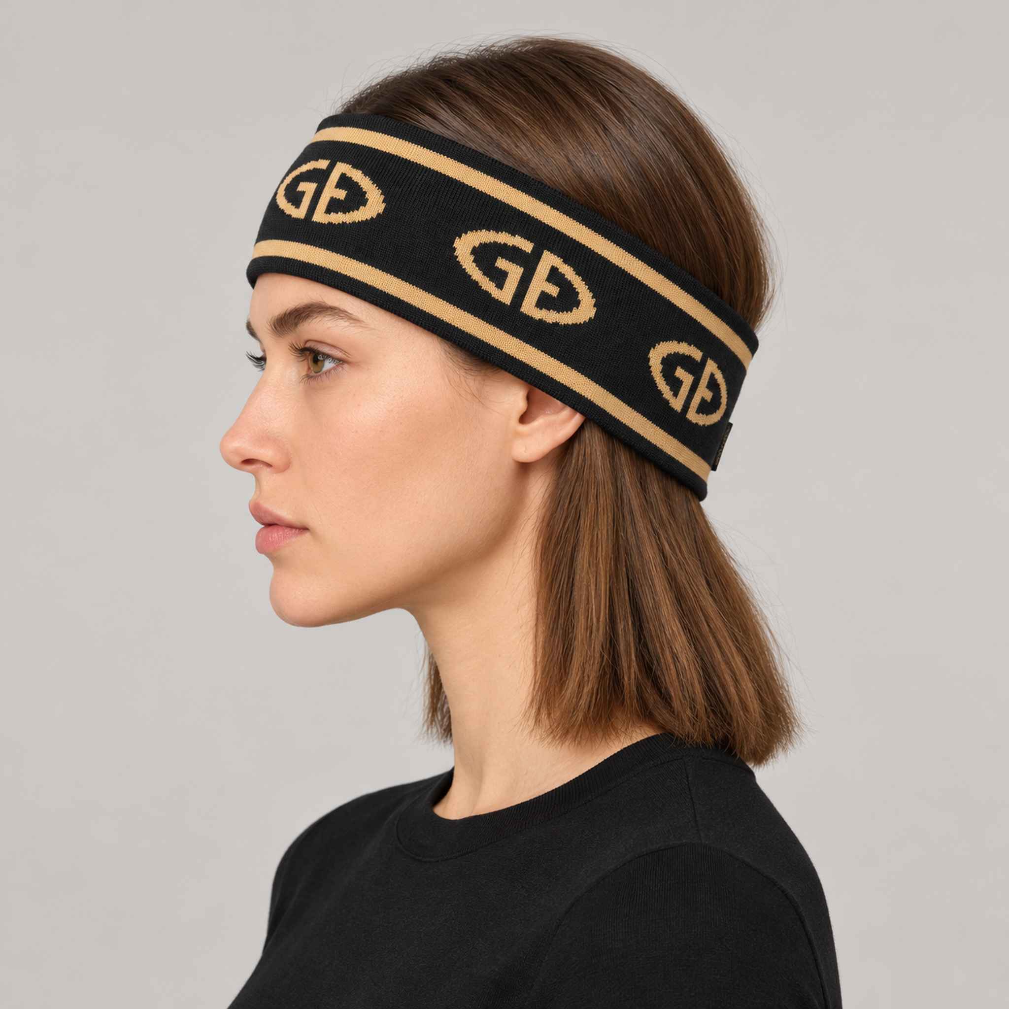 Goldbergh Tiara Headband in Black/Gold in Black Gold — womens side. AI-generated from manufacturer reference photographs.