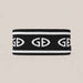 Goldbergh Tiara Headband in Black in Black White — side. AI-generated from manufacturer reference photographs.