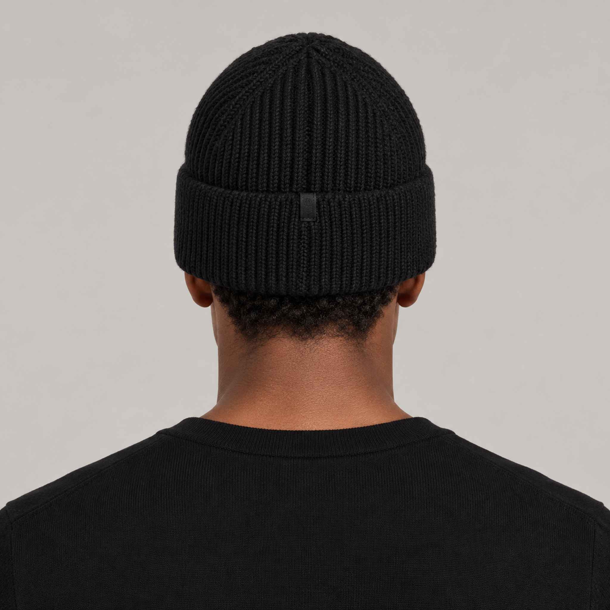 Goldbergh Valerie Beanie in Black in Black — mens back. AI-generated from manufacturer reference photographs.