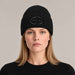 Goldbergh Valerie Beanie in Black in Black — womens front. AI-generated from manufacturer reference photographs.