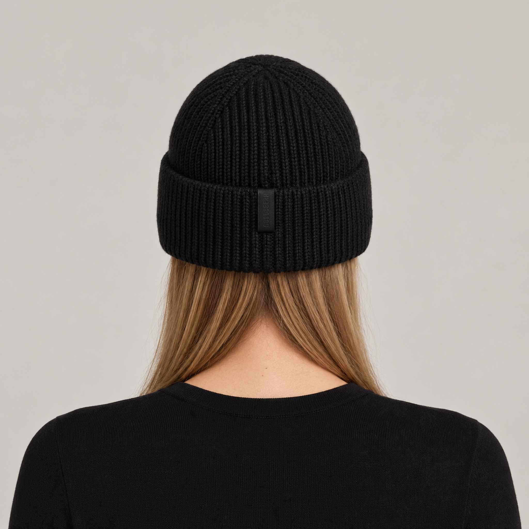 Goldbergh Valerie Beanie in Black in Black — womens back. AI-generated from manufacturer reference photographs.