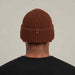 Goldbergh Valerie Beanie in Deep Mocha in Deep Mocha — mens back. AI-generated from manufacturer reference photographs.