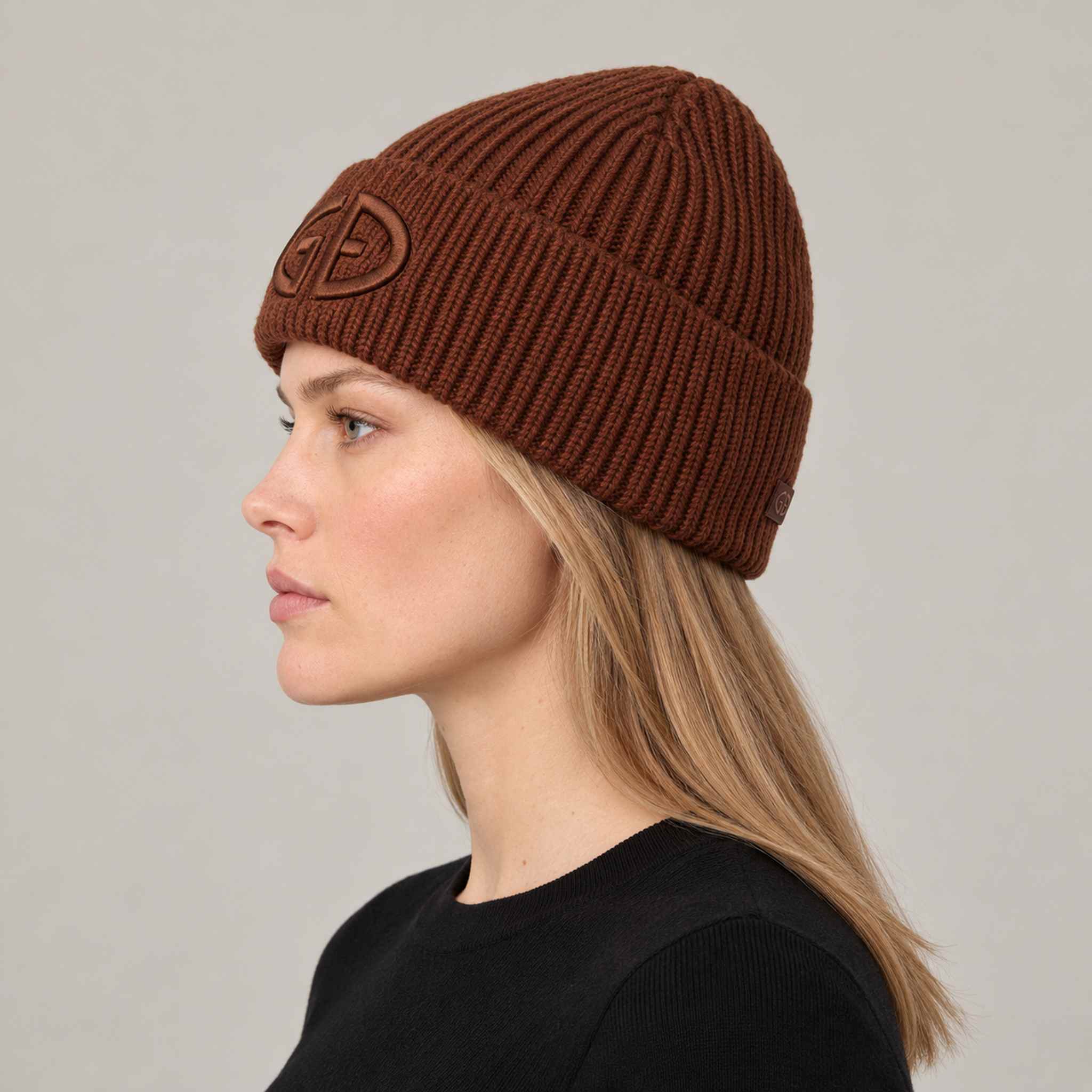 Goldbergh Valerie Beanie in Deep Mocha in Deep Mocha — womens side. AI-generated from manufacturer reference photographs.