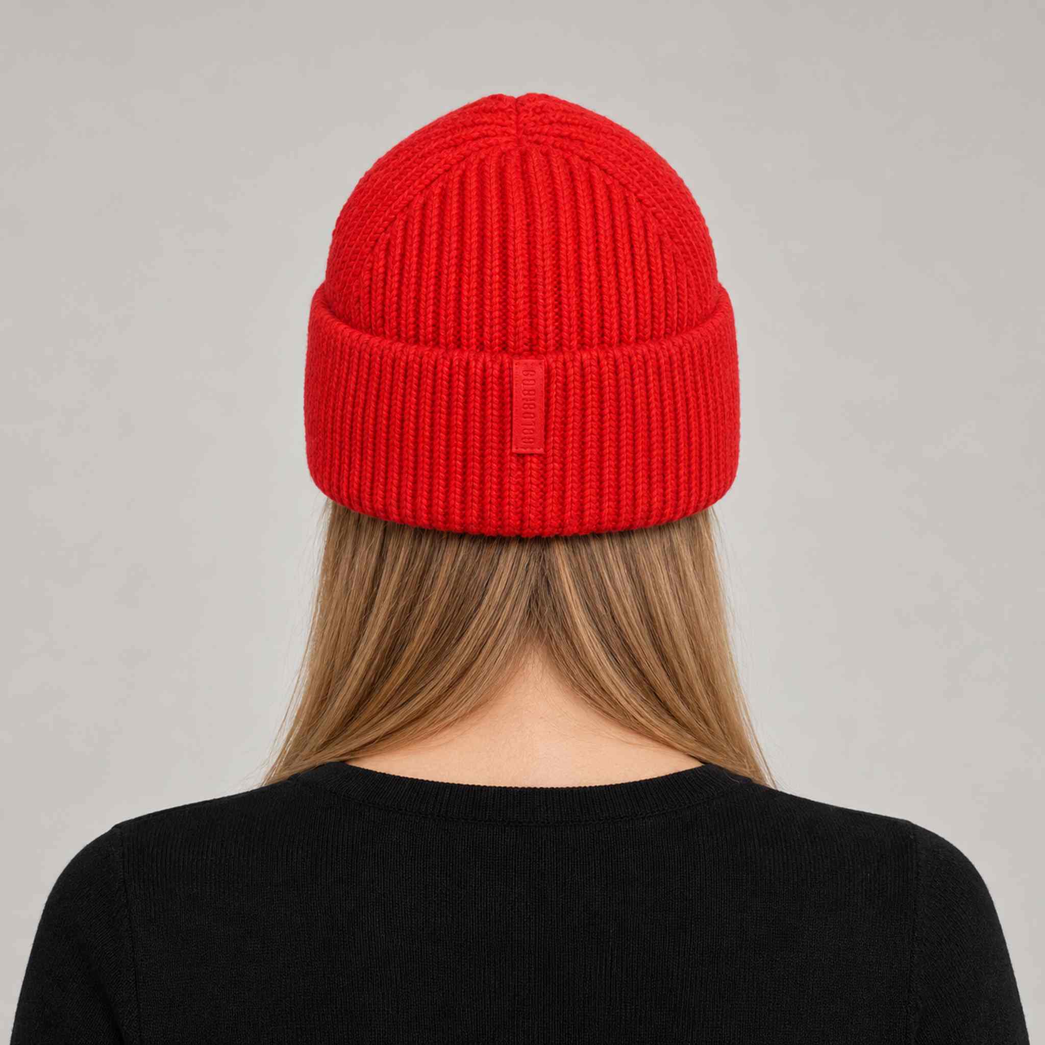 Goldbergh Valerie Beanie in Flame in Flame — womens back. AI-generated from manufacturer reference photographs.