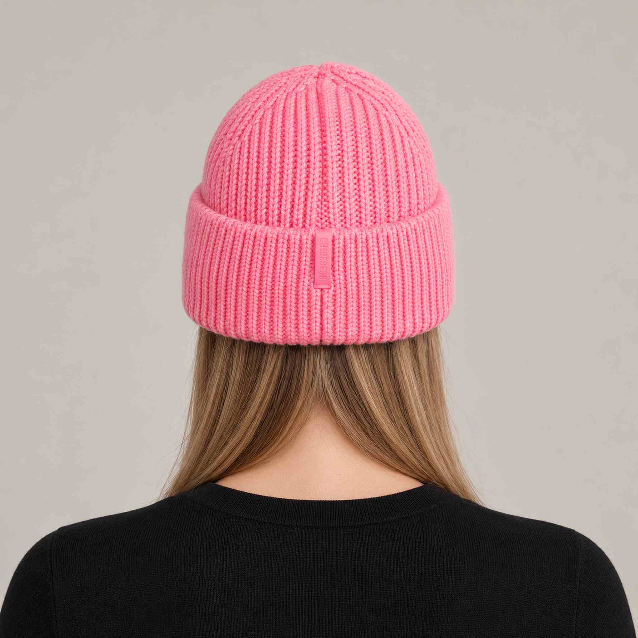 Goldbergh Valerie Beanie in Pink Cosmos in Pink Cosmos — womens back. AI-generated from manufacturer reference photographs.