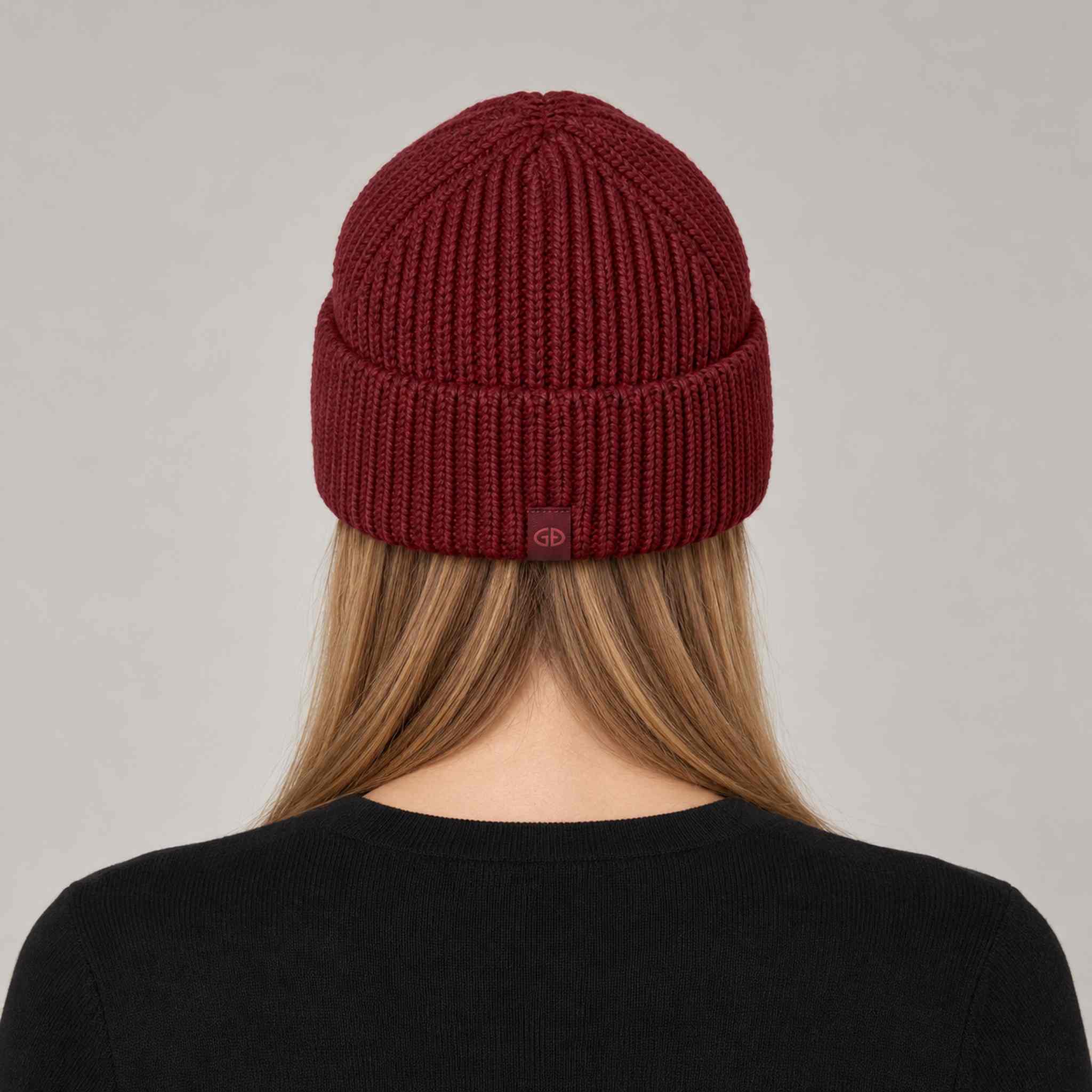 Goldbergh Valerie Beanie in Vino Rosso in Vino Rosso — womens back. AI-generated from manufacturer reference photographs.