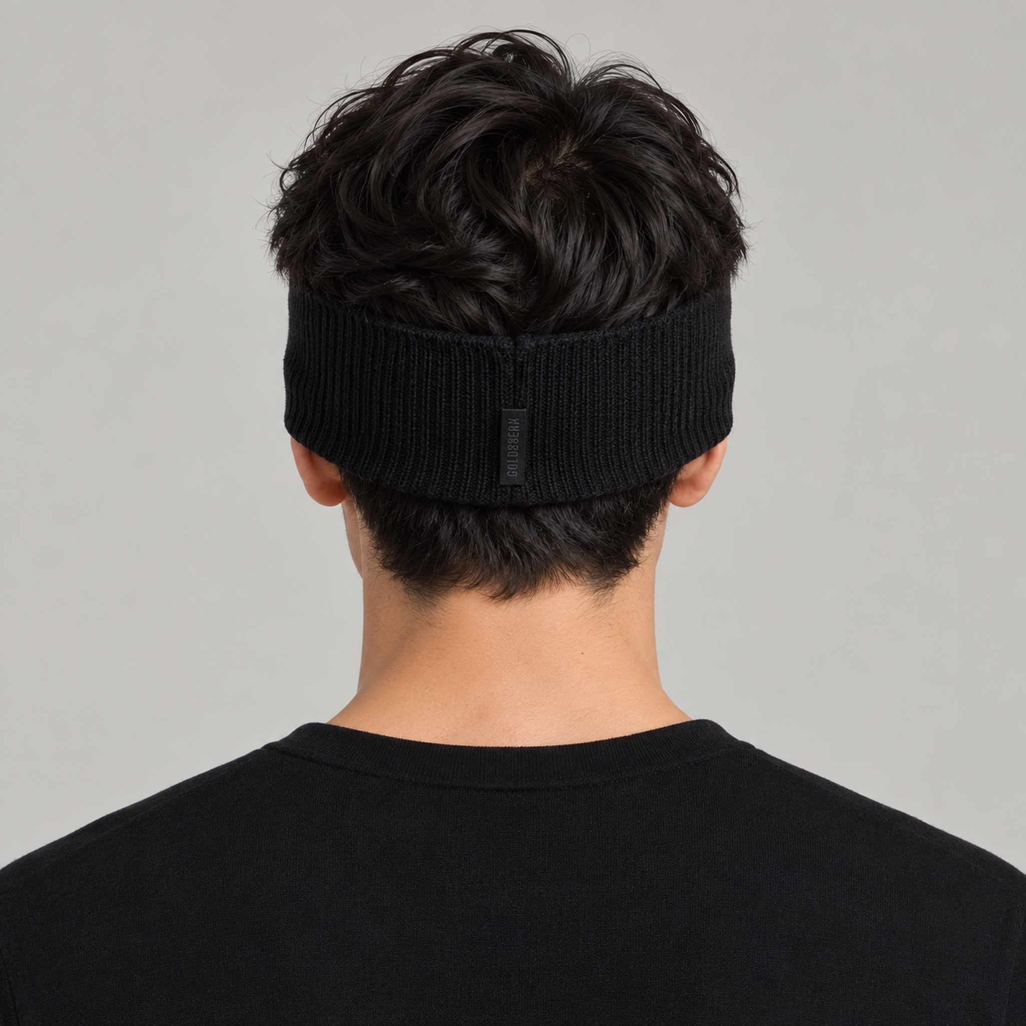 Goldbergh Warmth Headband in Black in Black — mens back. AI-generated from manufacturer reference photographs.