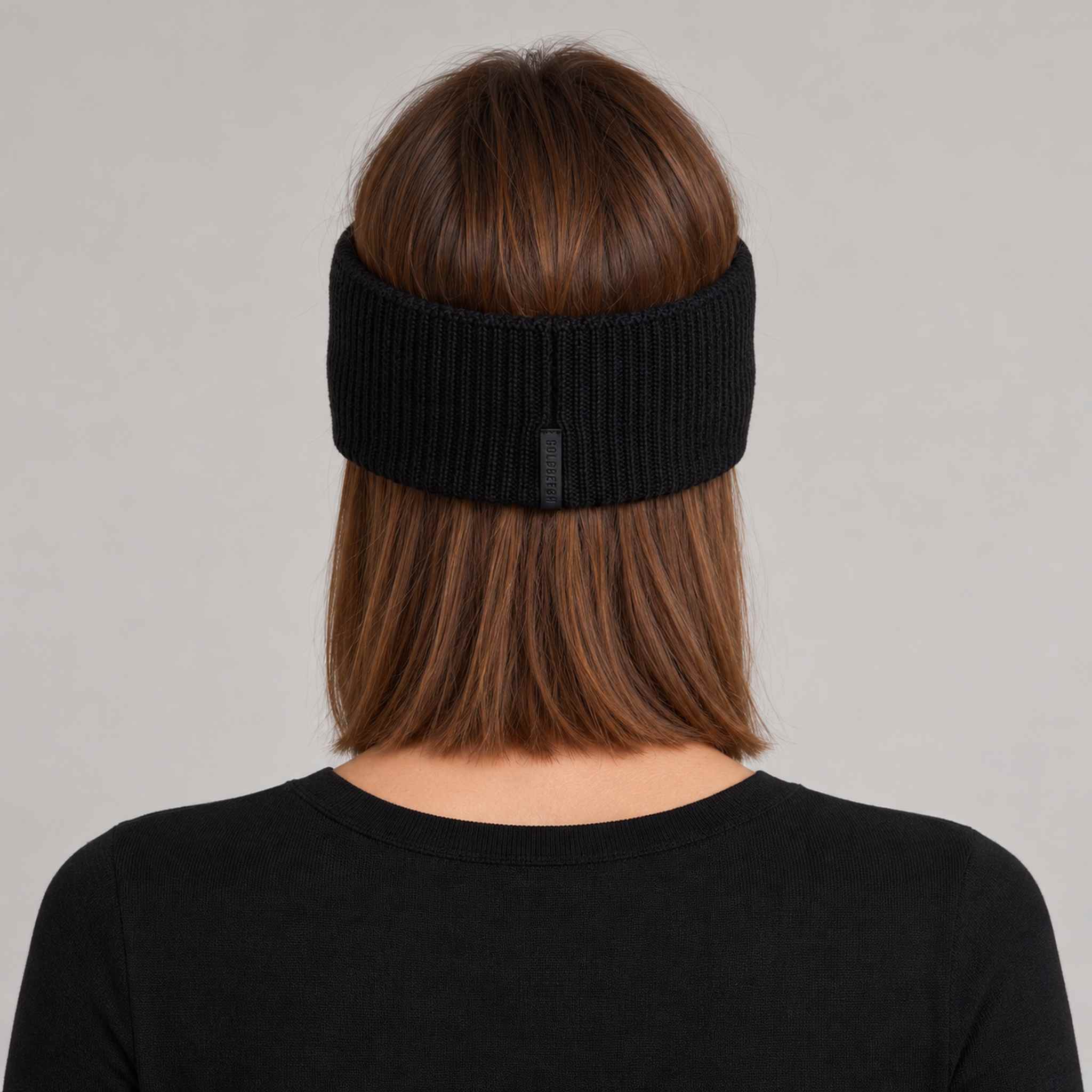Goldbergh Warmth Headband in Black in Black — womens back. AI-generated from manufacturer reference photographs.
