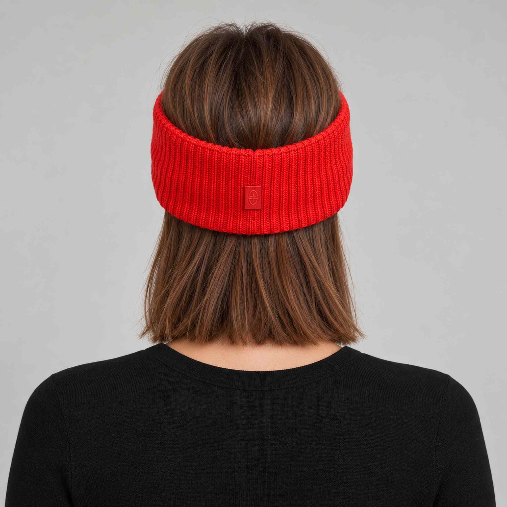 Goldbergh Warmth Headband in Flame Red in Flame — womens back. AI-generated from manufacturer reference photographs.