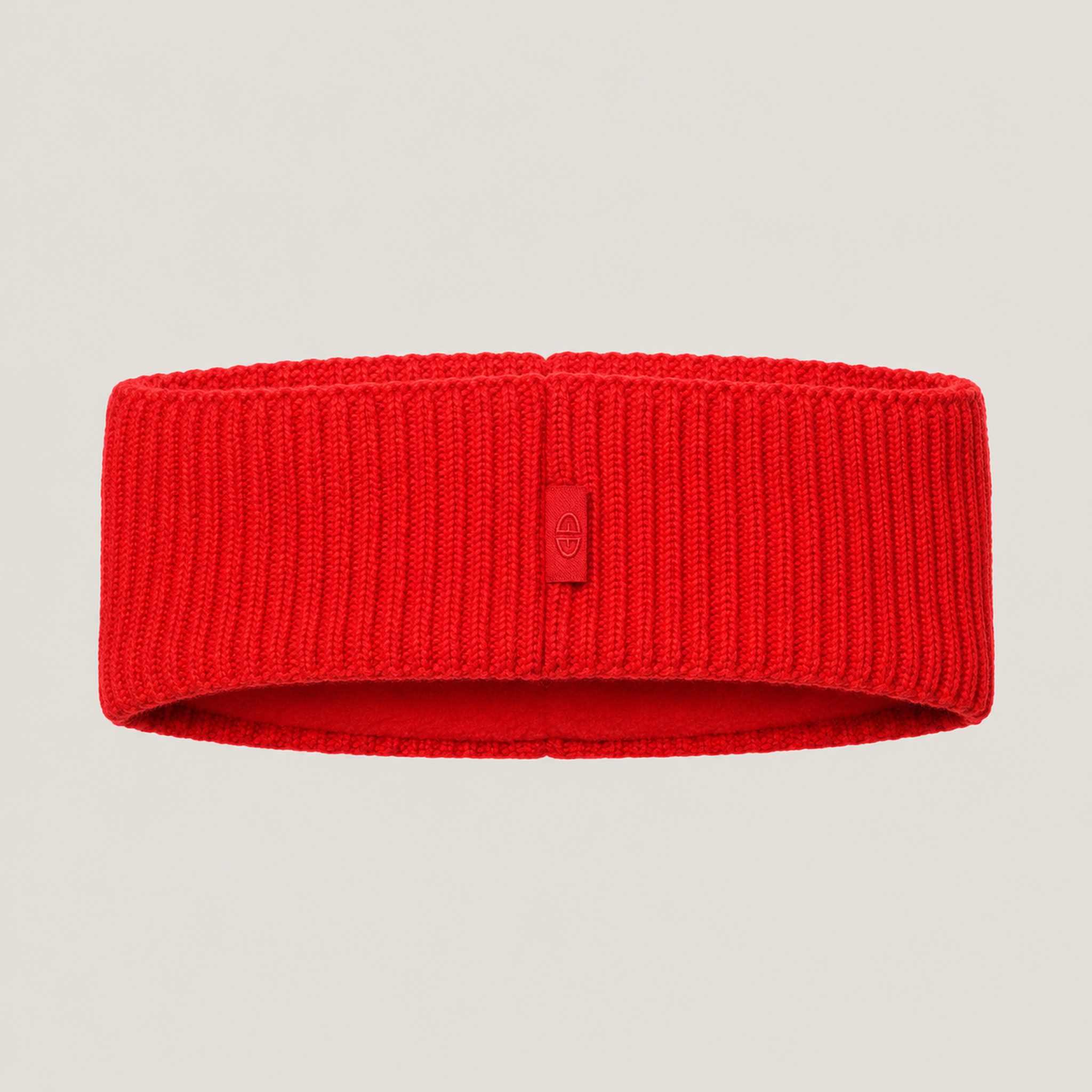 Goldbergh Warmth Headband in Flame Red in Flame — back. AI-generated from manufacturer reference photographs.