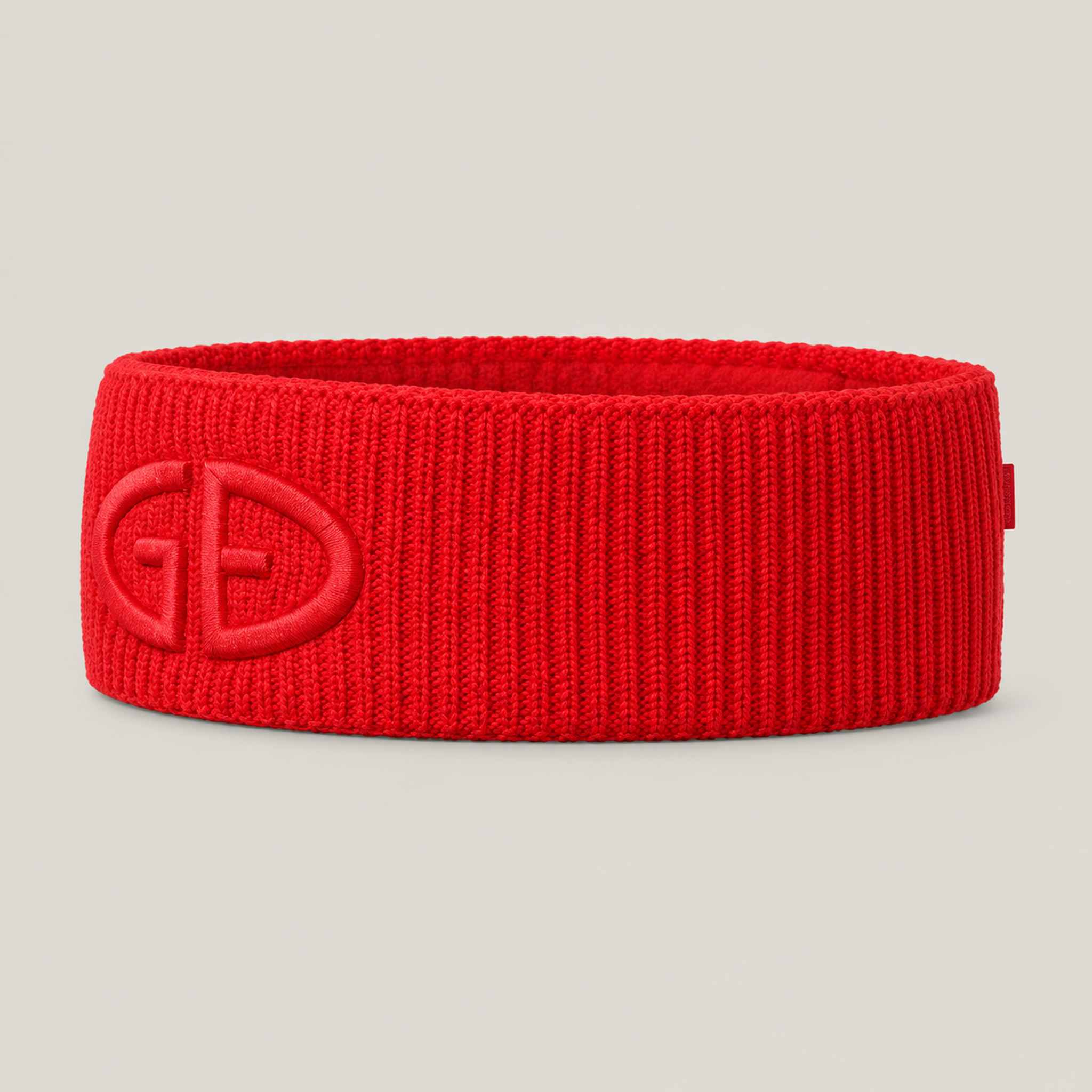 Goldbergh Warmth Headband in Flame Red in Flame — side. AI-generated from manufacturer reference photographs.