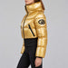 Goldbergh womens Bombardino Ski Jacket in Rich Gold (Rich Gold) - model side. AI-generated from manufacturer imagery.