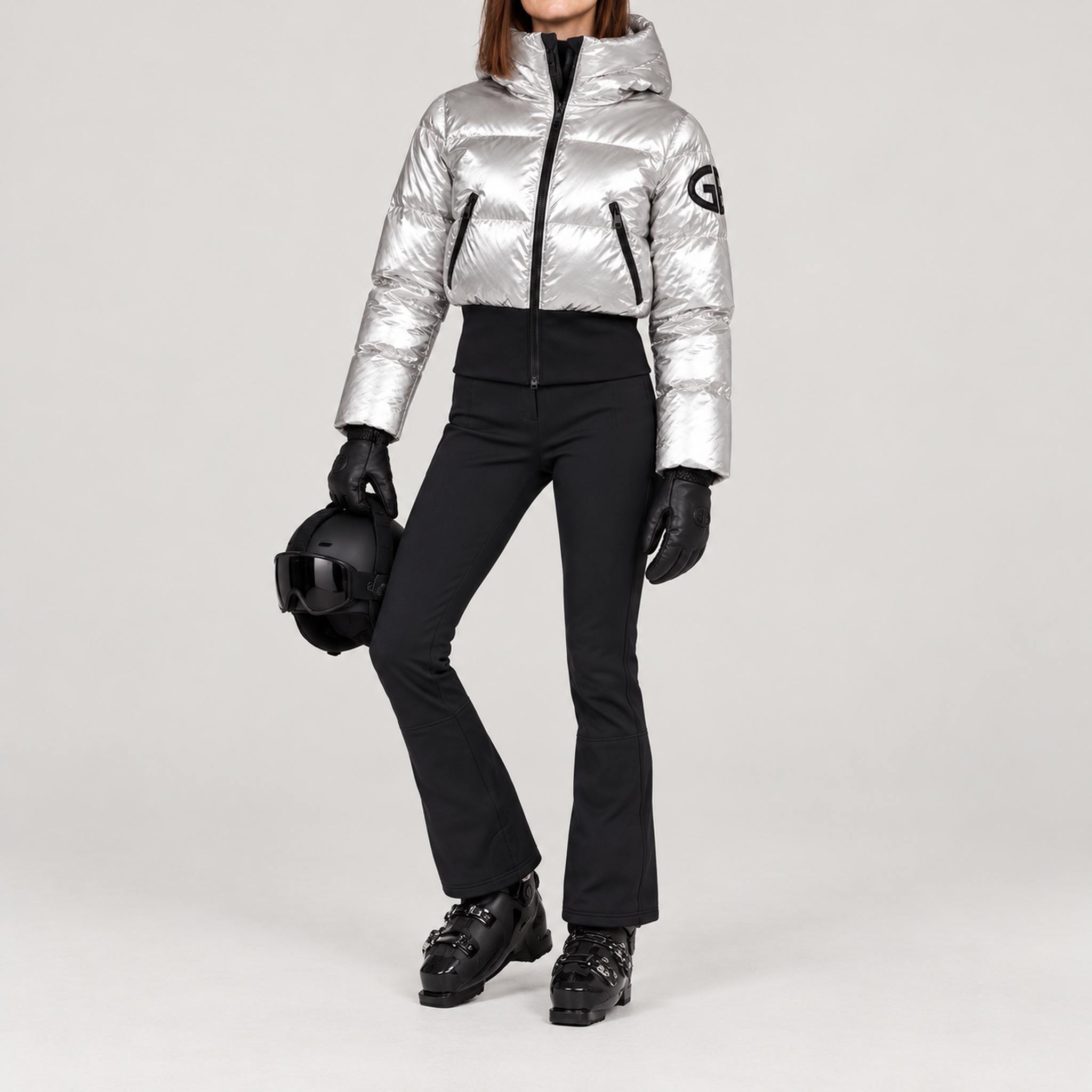 Goldbergh women's Bombardino Ski Jacket in Silver – ski pose view. AI-generated from manufacturer imagery.