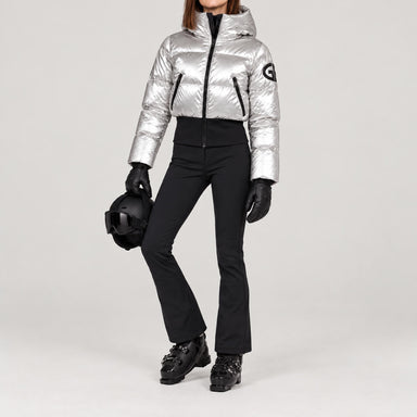 Goldbergh women's Bombardino Ski Jacket in Silver – ski pose view. AI-generated from manufacturer imagery.