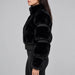 Goldbergh womens Furry Ski Jacket (Black) - model side. AI-generated from manufacturer imagery.