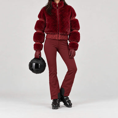Goldbergh women's Furry Ski Jacket in Vino Rosso – ski pose view. AI-generated from manufacturer imagery.