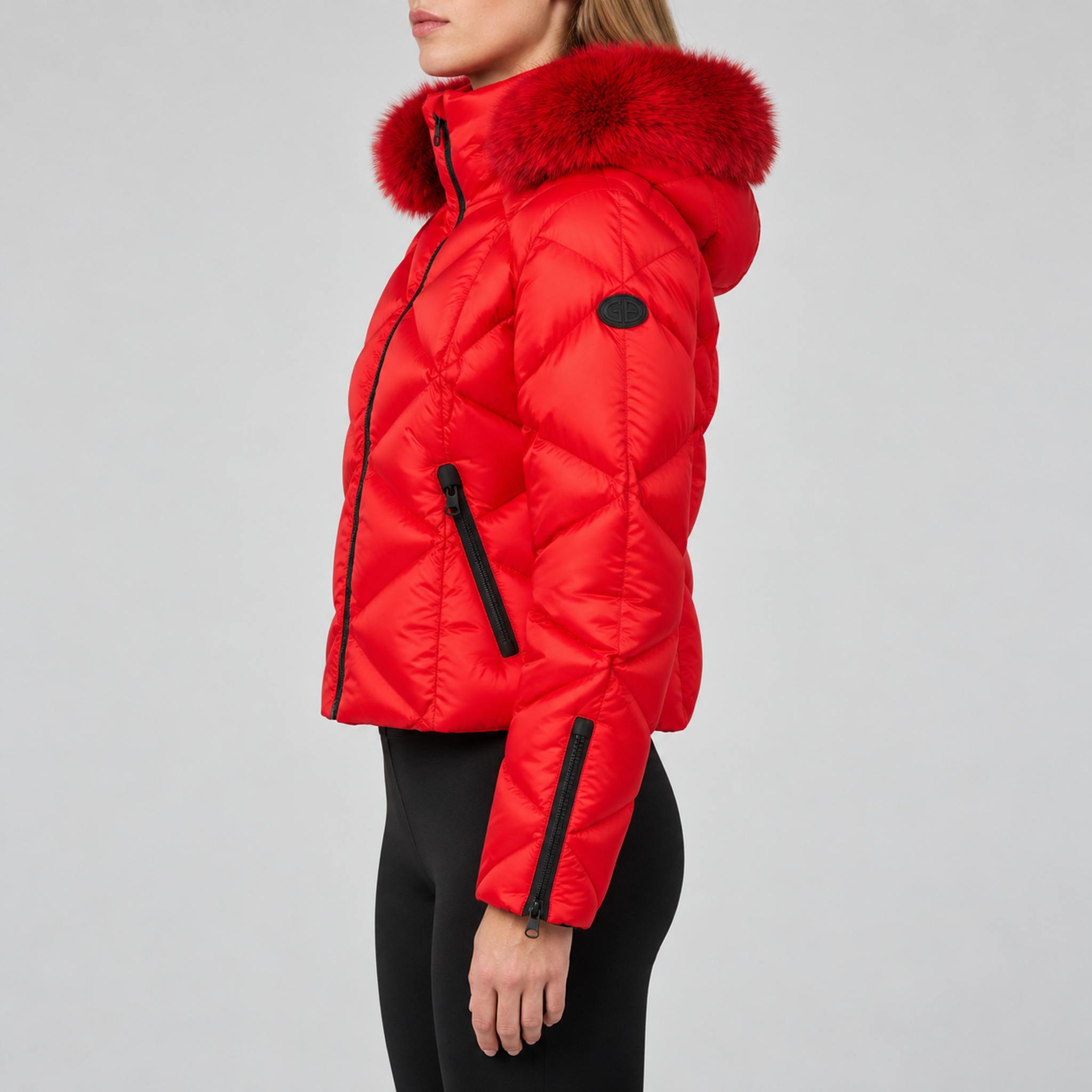 Goldbergh womens Harumi Ski Jacket in Flame Red (Flame) - model side. AI-generated from manufacturer imagery.