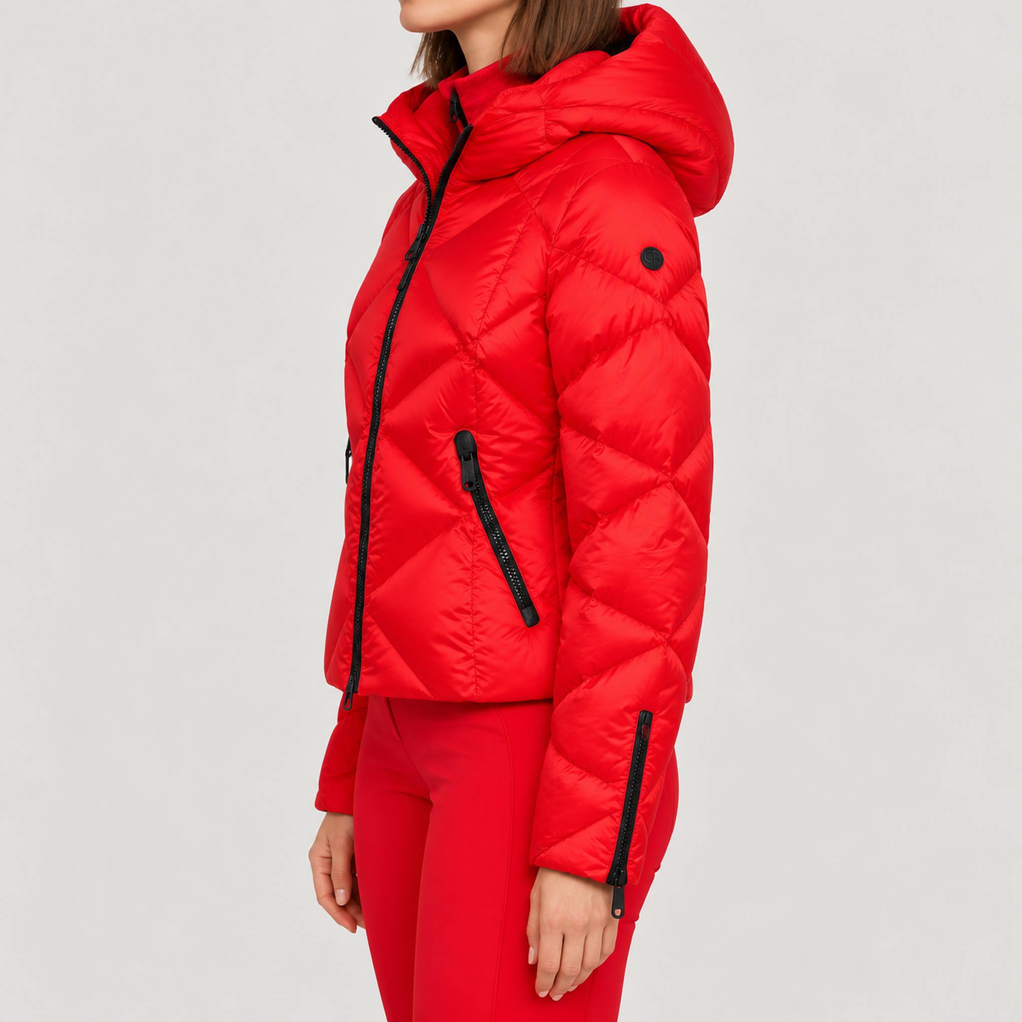 Goldbergh women's Harumi Ski Jacket in Flame Red – model side view. AI-generated from manufacturer imagery.