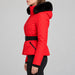 Goldbergh womens Hida Ski Jacket in Flame Red (Flame) - model side. AI-generated from manufacturer imagery.