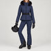 Goldbergh women's Hida Ski Jacket in French Blue – ski pose view. AI-generated from manufacturer imagery.