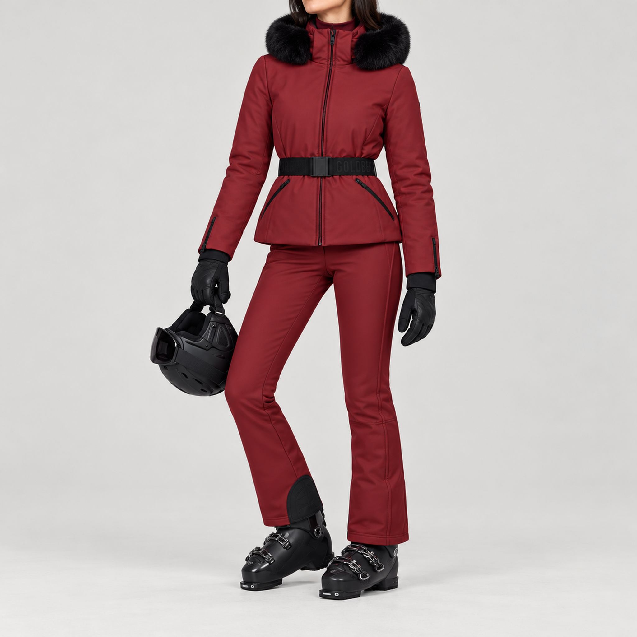 Goldbergh women's Hida Ski Jacket in Vino Rosso – ski pose view. AI-generated from manufacturer imagery.