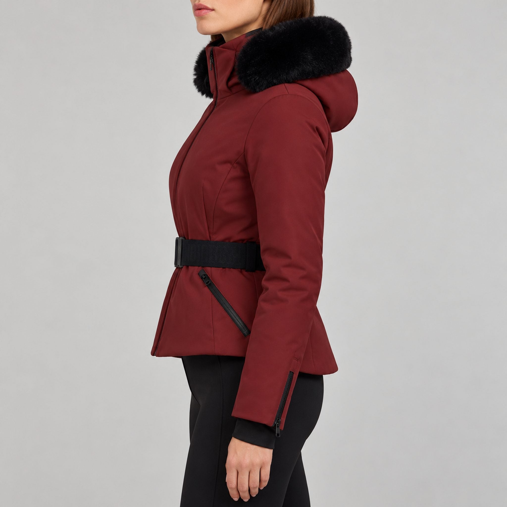 Goldbergh womens Hida Ski Jacket in Vino Rosso (Vino Rosso) - model side. AI-generated from manufacturer imagery.