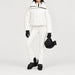 Goldbergh women's Koi Ski Jacket in White – ski pose view. AI-generated from manufacturer imagery.