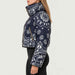 Goldbergh womens Kyoko Ski Jacket (Bandana Paisley Blue) - model side. AI-generated from manufacturer imagery.